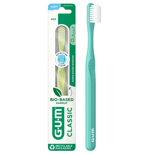 GUM Classic 409 Soft Toothbrush in its green packaging next to a teal-colored toothbrush.
