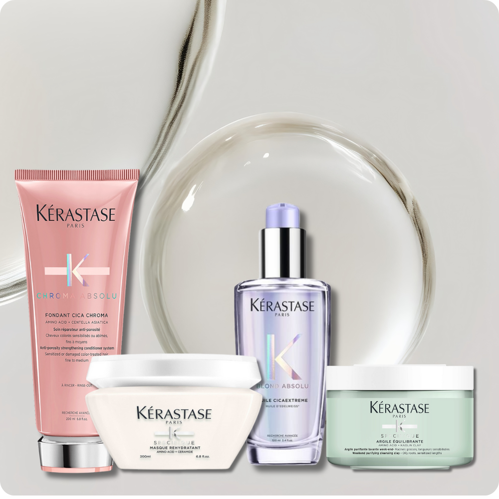 Four Kerastase products displayed in front of a drop of serum.