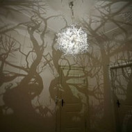 Chandelier that turns the bedroom in a forest