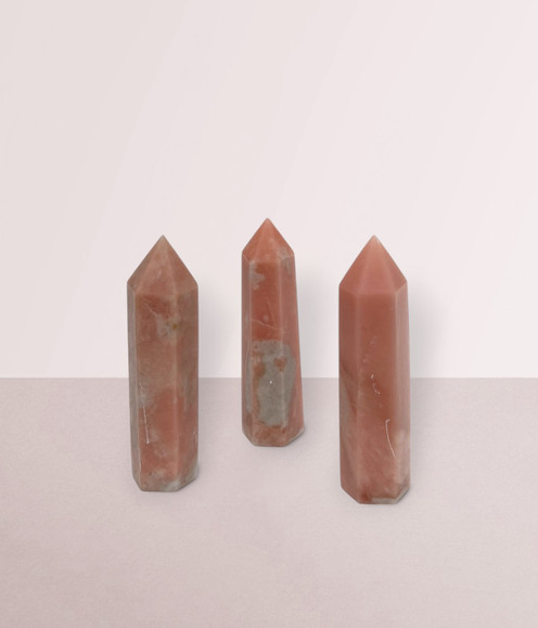 PInk Opal - a variety of points in small sizes, against a light pink background.