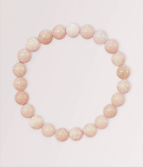 Pink Opal - a variety of beaded bracelets, against a light pink background.