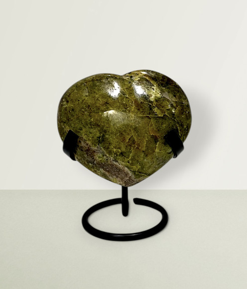 Green Opal Heart - solo piece #3, from the front, against a light lime coloured background. Green Opal Heart - solo piece #3, from the front, against a light lime coloured background.