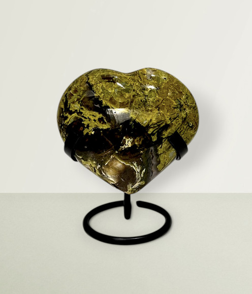 Green Opal Heart - solo piece #4, from the front, against a light lime coloured background. Green Opal Heart - solo piece #4, from the front, against a light lime coloured background.