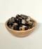 Septarian - a bowl of assorted tumbled pieces, against a light cream coloured background.