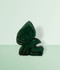 Aventurine Eagle Carving - unique piece #2, facing right, against a mint green background.