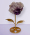 Amethyst Flower Carving, display #3, held up on a gold metal display stand, front-facing, against a cool lilac background.
