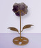 Amethyst Flower Carving, display #3, held up on a gold metal display stand, back-facing, against a cool lilac background.