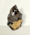 Septarian Flame - unique piece #1, back-facing, against a light cream coloured background.