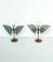Caribbean Calcite Butterfly Displays - a variety of pieces in a small size, front-facing, against a cool blue-green coloured background.