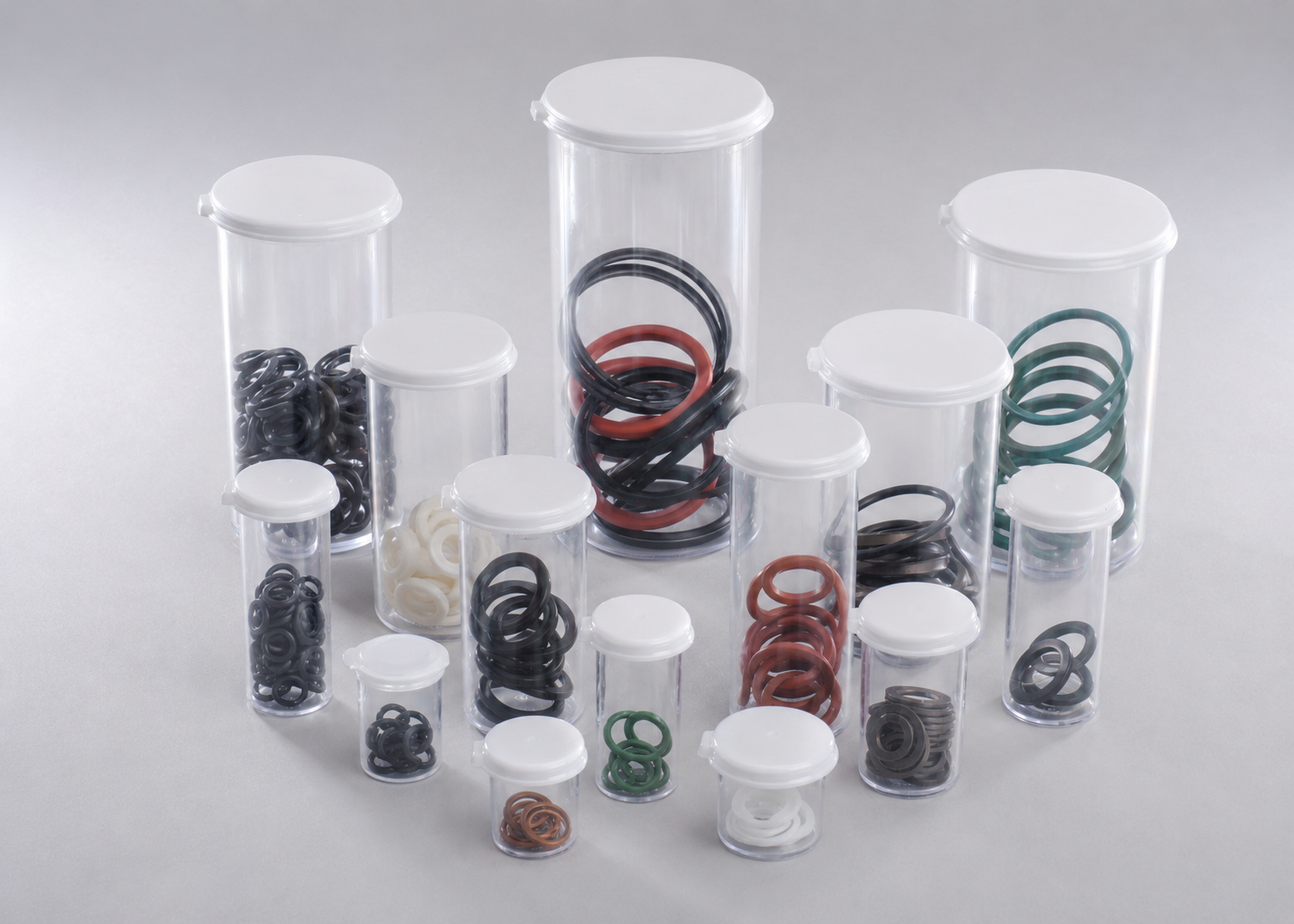 Clear plastic vials holding O-rings, seals, and washers for an industrial repair kit