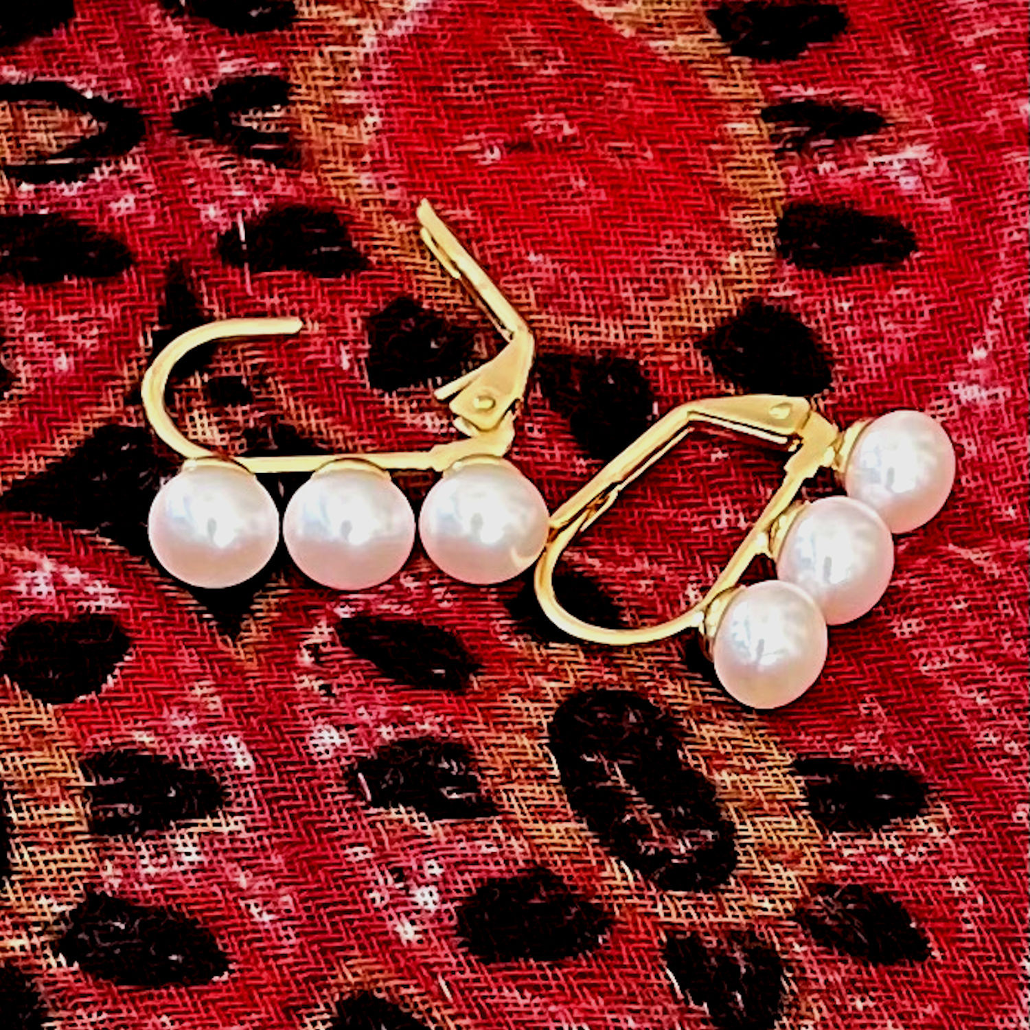 Single oval shaped white freshwater pearl earring on silver chain, Aster