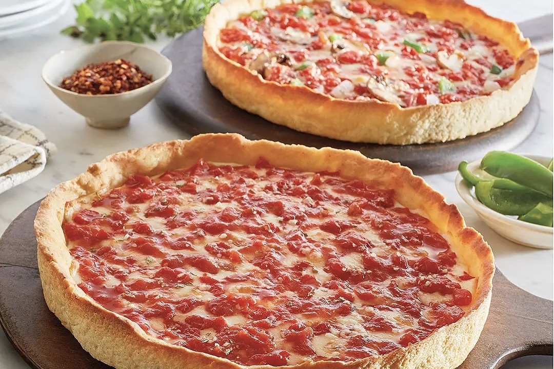 two deep dish pizzas