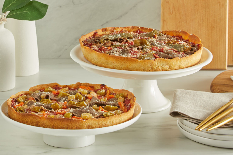 two pizzas on holders