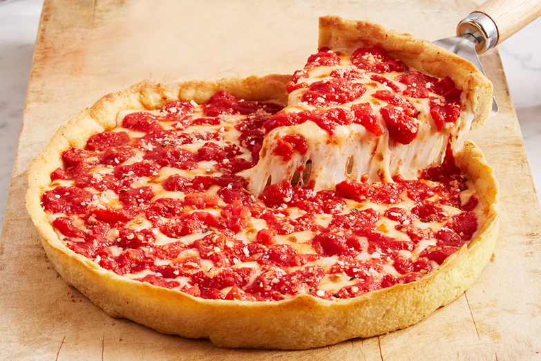 cheese pizza slice pulled from pie