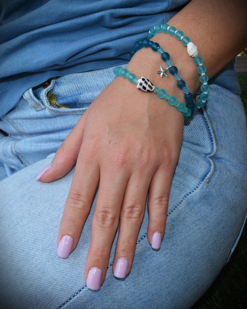 blue bead bracelet with charm
Hawaii shell bracelet
blue bead bracelet with starfish 
starfish bead bracelet at Bottled Ocean Treasures
sterling silver starfish charm
Stainless steel bracelet with starfish
