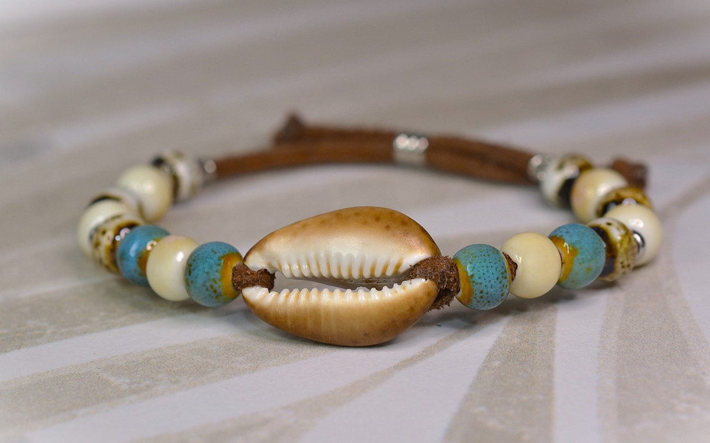 cowrie bracelet,
suede and seashell,
Porcelain bead bracelet,
Buy suede shell bracelet,
Hawaii cowrie shells,
suede shell bracelet,
cowrie shell and suede bracelet,
where to buy suede bracelet with Hawaii shells,
suede bracelet at Bottled Ocean Treasures,
