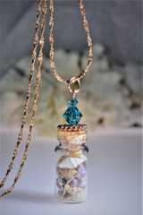 rose gold necklace with seashells
seashells in bottle
bottle necklace