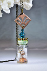 Olivine sand and shells
shells in bottle
seashell necklace