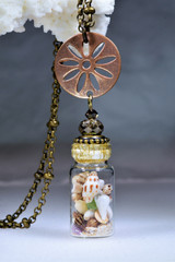 Brass seashell necklace
seashells in bottle