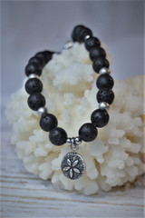 Lava bead bracelet
Stainless steel bracelet
Sand dollar charm
Sand dollar charm bracelet with lava beads
Sterling silver sand dollar
Black lava beads