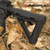 Durable Magpul MOE Carbine Stock in a field environment, highlighting its rugged construction and sling mounting options.