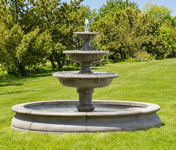 103-inch Campania Newport Pool with tiered fountain in a garden