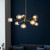 Empathic Lighting Merlin 9 Arm Light In Satin Brass And Matt Black 
