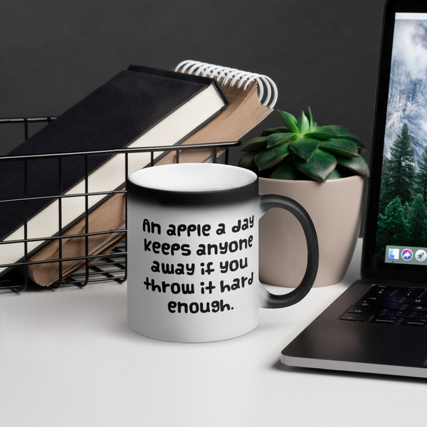 An apple a day keeps anyone away if you throw it hard enough. - Matte Black Magic Mug Funny quotes 7838540