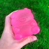 Top Trenz Pink Super Duper Sugar Squisher Toy - Pig in models hand