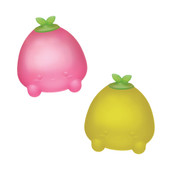 The Sugar Squisher Mini Fruits 2-Pack arranged in a playful setting, featuring the strawberry and pineapple squishy toys, highlighting their cute and collectible nature