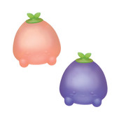 The Sugar Squisher Mini Fruits 2-Pack arranged in a playful setting, featuring the peach and grape squishy toys, highlighting their cute and collectible nature