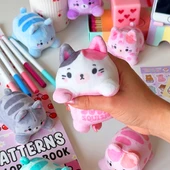 Plush Purrfect Pals in hand