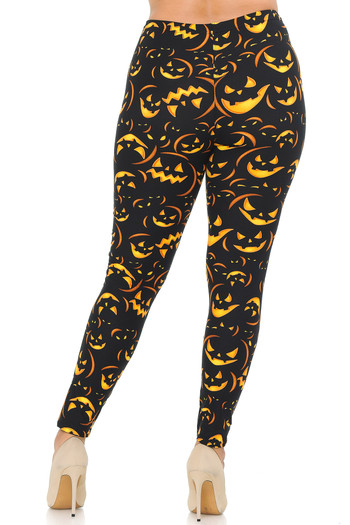 Rear view of our body-flattering Buttery Soft Evil Halloween Pumpkins Plus Size Leggings, perfect for a festive fall outfit.