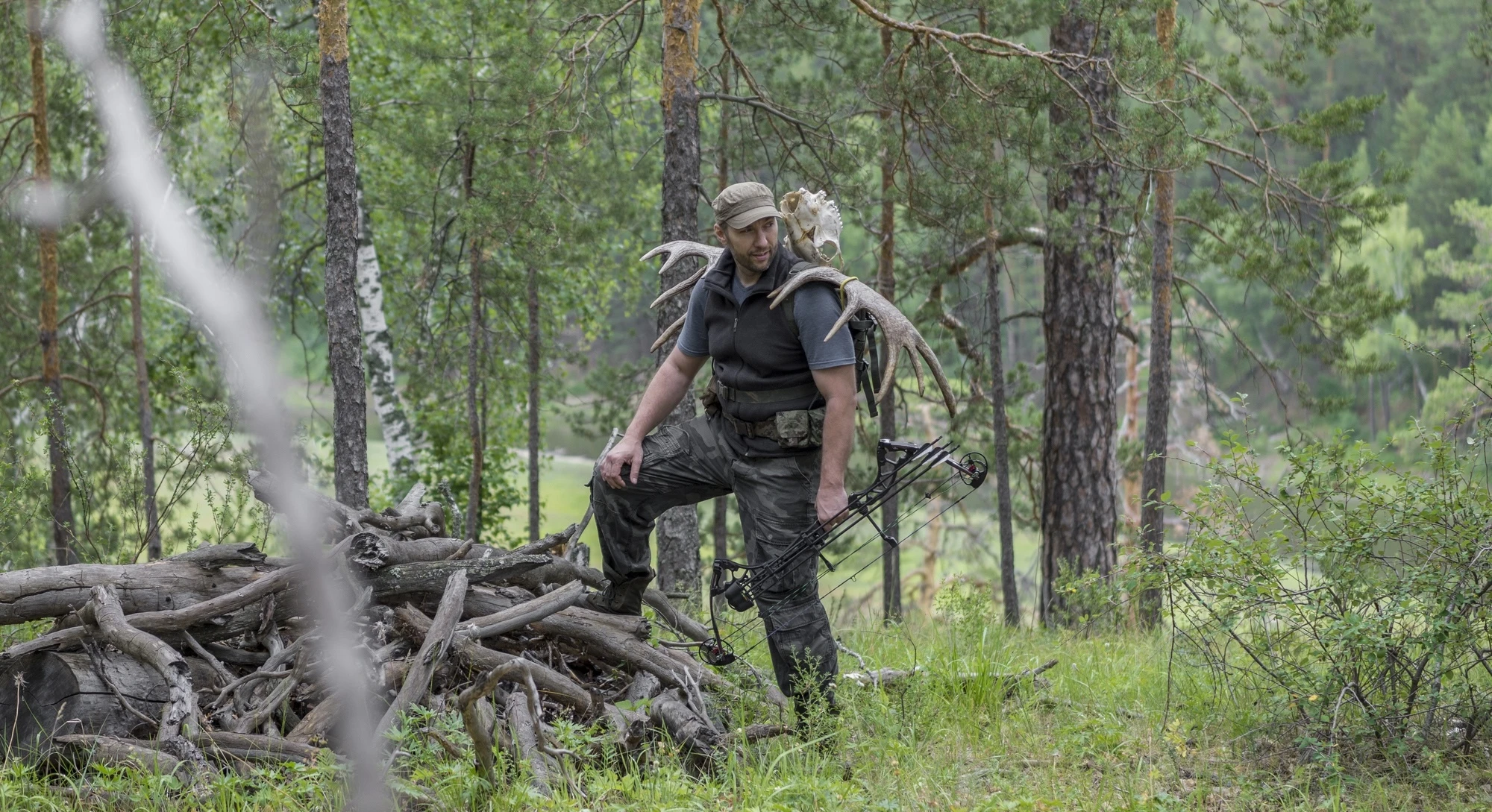 hunter with a bow in the woods