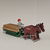Horses Pulling Green Timber Sleigh - Wooden German Figurine – side view of the Christmas ornament