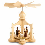 A beautifully handcrafted German Christmas pyramid featuring a traditional Nativity scene with turned wooden figures. Made from natural wood and powered by pyramid candles for a timeless holiday display.