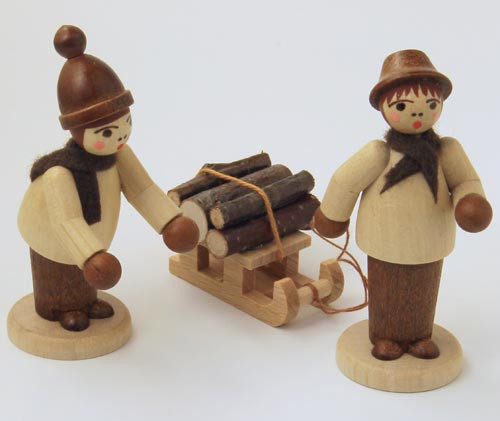 Wooden German Forest Kids Figurine with Sled Handmade – alternate view of the Christmas ornament