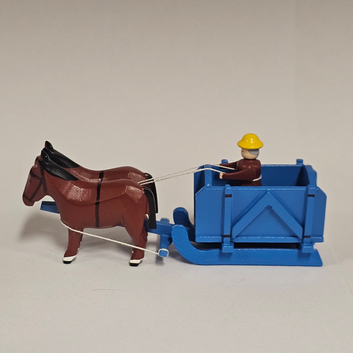 Horses Pulling Empty Blue Box Sleigh - Wooden German Figurine – side view of the Christmas ornament