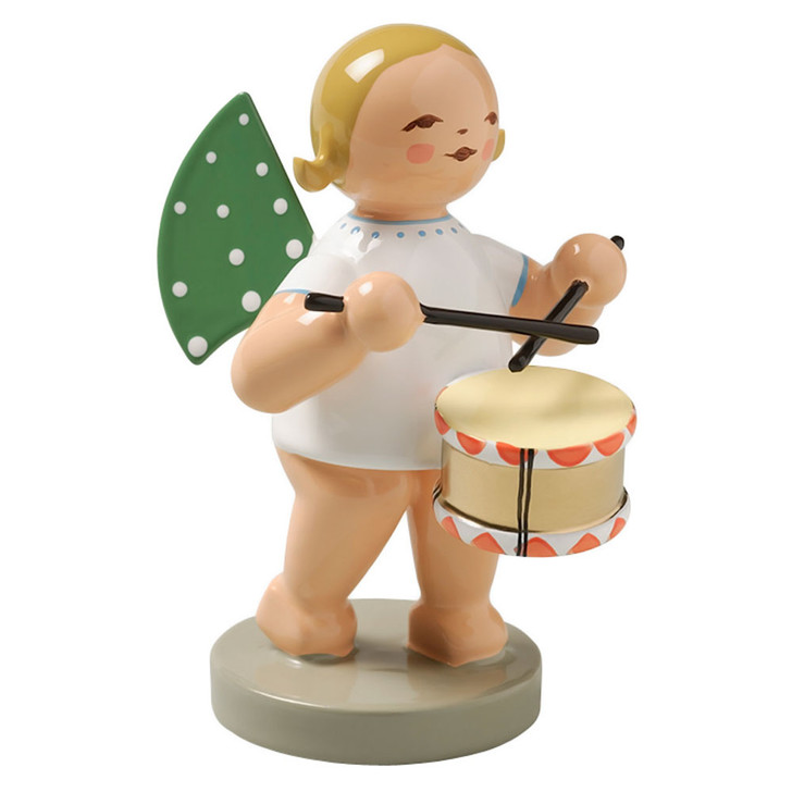 This little Wendt and Kuehn Angel Figurine is playing her drum. Stands 2 1/2 inches tall. Made in Germany. Create your own Heavenly Holiday scene with Handcrafted German Figurines. These German Figurines make wonderful decorations and can be added to throughout the years for generations of enjoyment