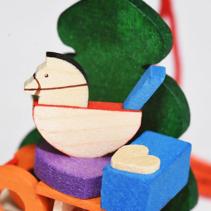 Kids Sled in front of Tree Ornament – alternate view of the Christmas ornament
