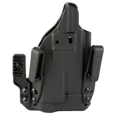 Side angle view showing magnetic retention and tuckable belt clips on MFT holster