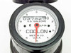Carlon JLP-96 water meter — close-up of open register dial showing US Gallons scale, red sweep hand, and JLP-96 model designation on dial face