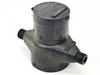 Carlon JLP-96 water meter — front-left three-quarter view showing polymer body, two 3/4 NPT threaded ports, and cylindrical register housing on top