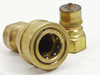 Tomco THK4 female coupler face-on view showing internal valve seal ring and ball detents; male plug in background