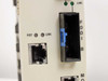 Cabletron FDMMIM-24 FDDI B port close-up – intact MIC connector housing with blue dust cover, adjacent RJ-45 port, green LNK LEDs lit