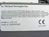 St. Michael Strategies STC112 bottom label showing model number STC112, serial number 02BB1007687, FCC and IC compliance text, CE mark, Made in Canada