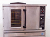 US Range CG-100 convection oven front view from slightly lower angle showing door, window with racks visible inside, and full control panel on right side