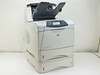 HP LaserJet 4200dtn Q2428A laser printer – right front three-quarter view with stacker open on top and two paper trays visible