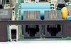 Practical Peripherals PM2400 modem card – close-up of bracket showing two RJ-11 telephone jacks and slide switch