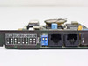 Practical Peripherals PM2400 bracket close-up showing RJ-11 PHONE and LINE jacks, DIP switch (Y1/Y2 ON), and COM1–COM4 selection chart